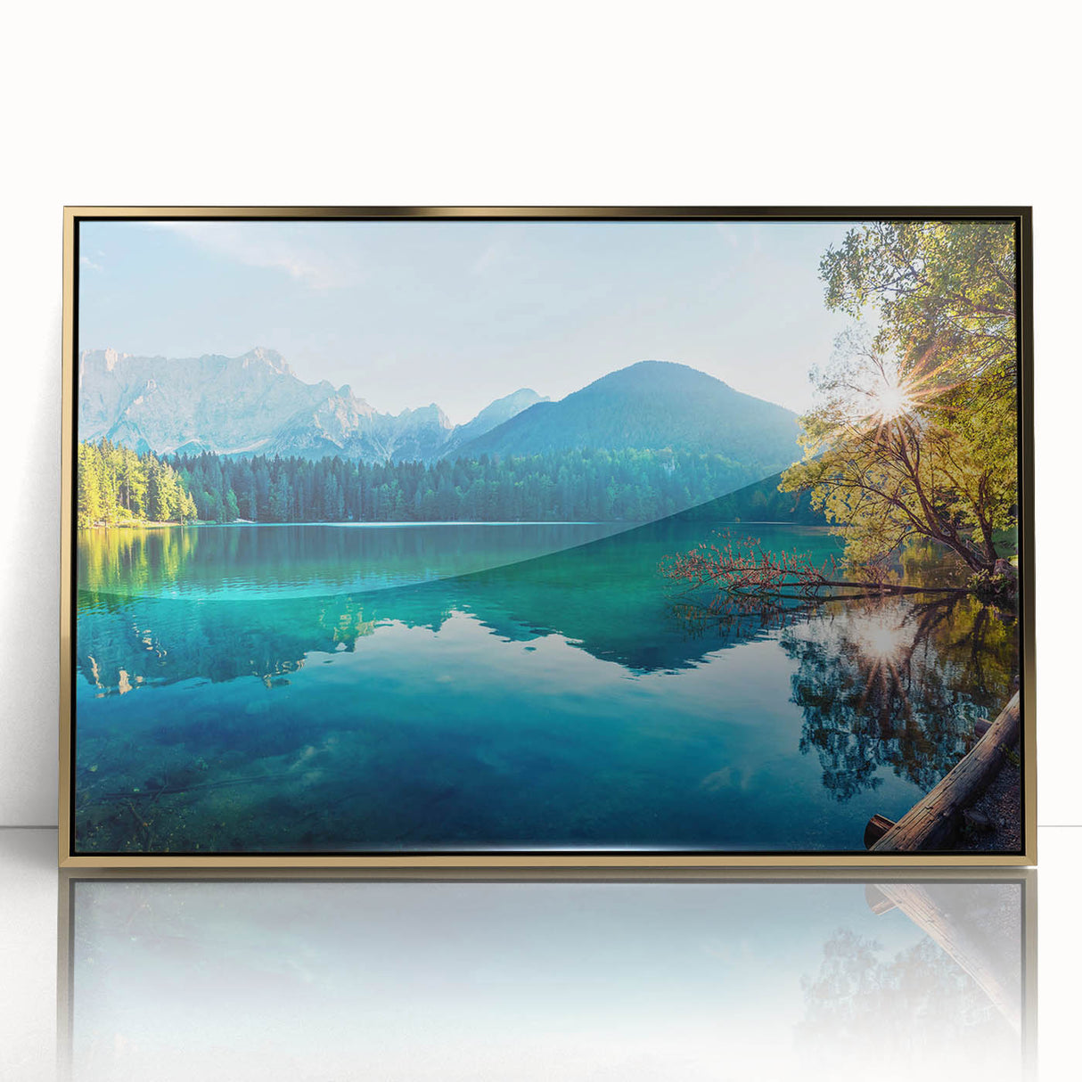 Framed acrylic wall art showcasing a serene landscape of a tranquil lake surrounded by lush greenery, highlighted by gold accents for an elegant touch. Perfect for modern home decor.