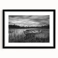 Framed wall art showcasing a serene lake landscape with vibrant colors, featuring a black mat and frame, ideal for enhancing home decor.