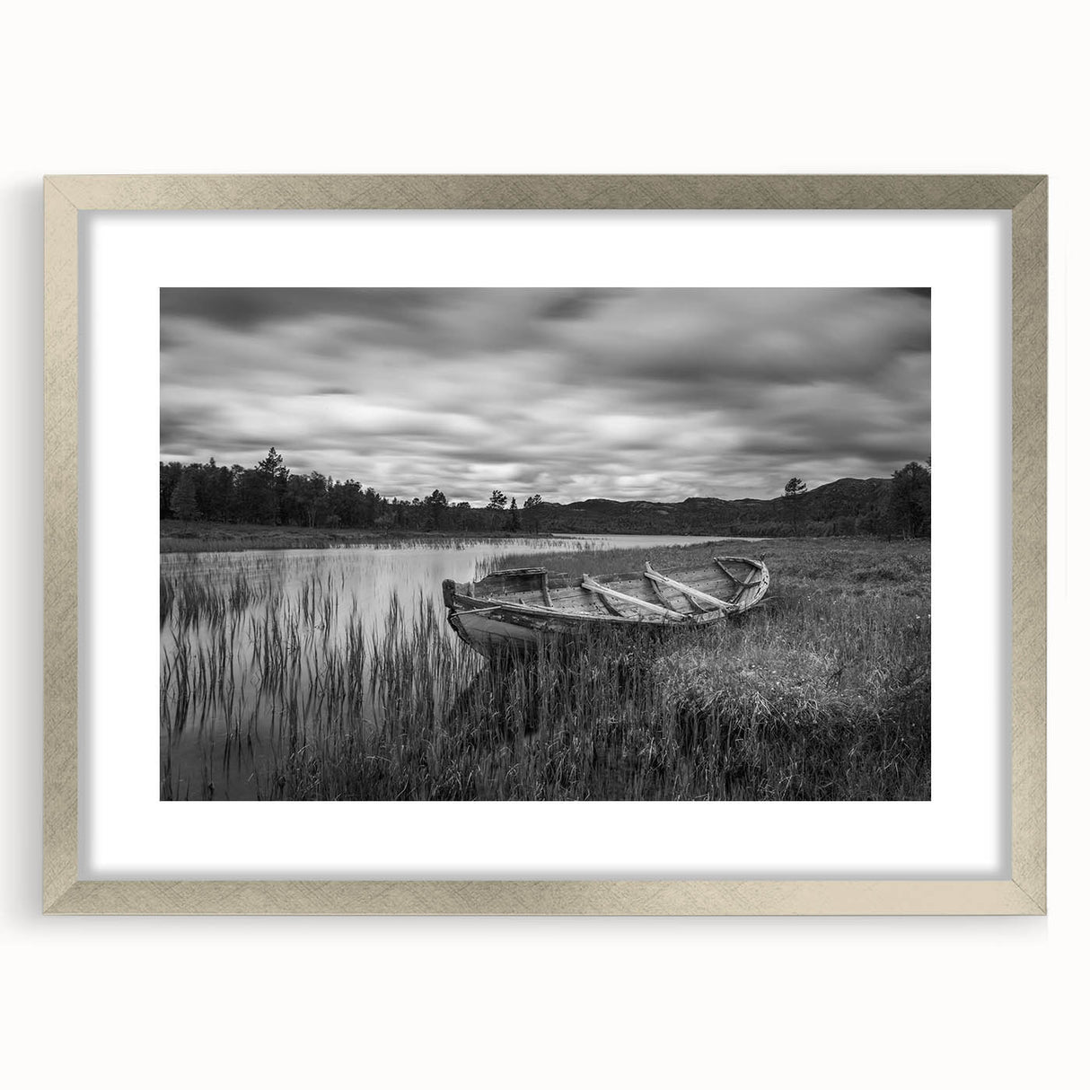 Framed wall art featuring a serene landscape with a tranquil lake, surrounded by lush greenery and soft clouds, presented in a sleek silver frame with a mat. Ideal for enhancing home decor with nature-inspired aesthetics.