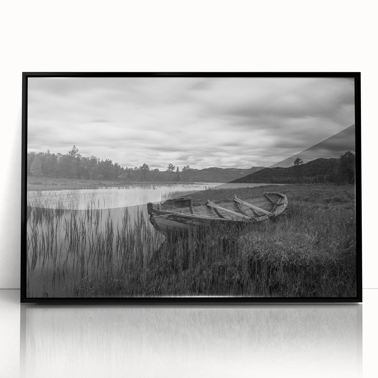 Framed wall art showcasing a serene landscape of a tranquil lake surrounded by lush greenery, presented in a sleek black frame, perfect for home decor enhancement.