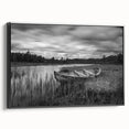Framed canvas wall art showcasing a serene lake landscape design with rich blues and greens, displayed at a slight angle to highlight its black frame and textured surface. Perfect for modern home decor.