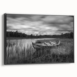 Framed canvas wall art showcasing a serene lake landscape design with rich blues and greens, displayed at a slight angle to highlight its black frame and textured surface. Perfect for modern home decor.