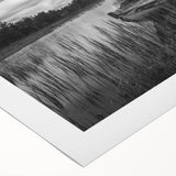 Vibrant rolled canvas artwork depicting serene lake landscapes with reflective water and lush greenery, ideal for home decor or art collectors, showcasing natural beauty.