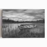 Stretched canvas wall art showcasing a serene lake landscape at sunset, featuring vibrant hues of orange and blue, perfect for home decor and relaxation.