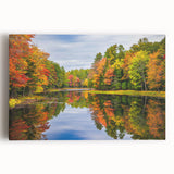 Stretched canvas wall art featuring a serene landscape of a lake surrounded by lush greenery and mountains, ideal for home decor and nature enthusiasts.