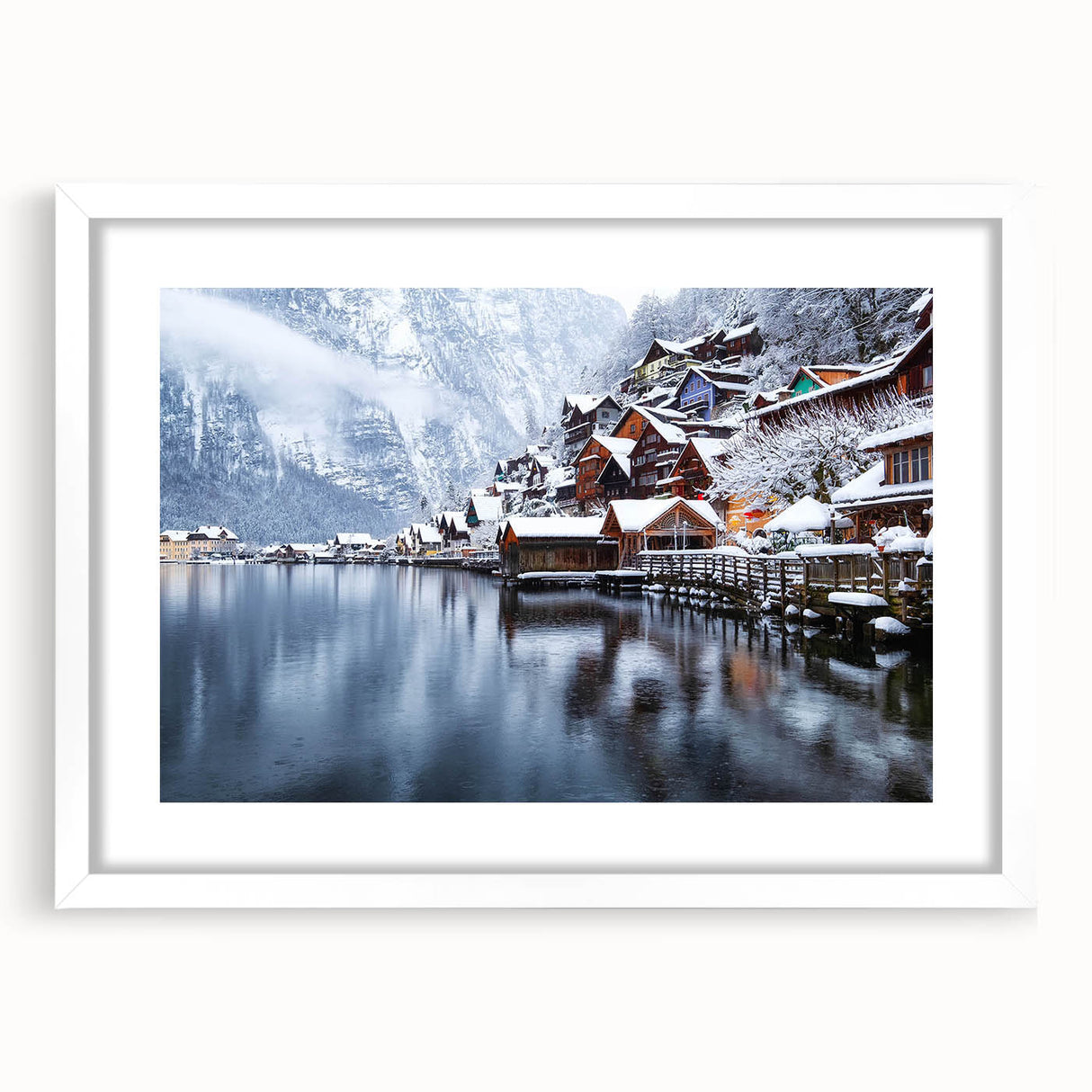 Framed wall art featuring a serene landscape of a tranquil lake surrounded by lush greenery, presented in a white frame with a mat for an elegant touch.