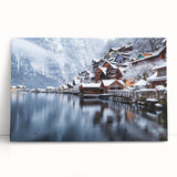 Stretched canvas wall art featuring a serene lakeside landscape design with vibrant blues and greens, leaning against a neutral wall, ideal for modern decor.