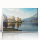Framed acrylic wall art showcasing a serene lake landscape in vibrant colors, set against a sleek white frame, perfect for modern home decor.