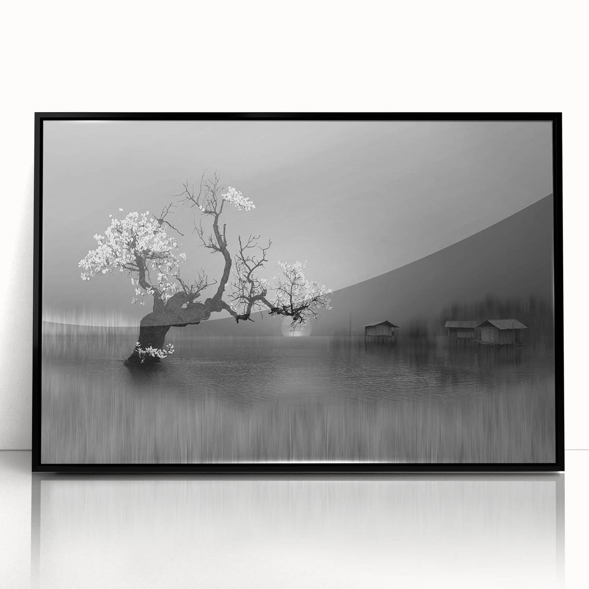 Framed wall art collection showcasing a serene landscape of a tranquil lake, featuring vibrant colors and a sleek black frame, ideal for home decor.