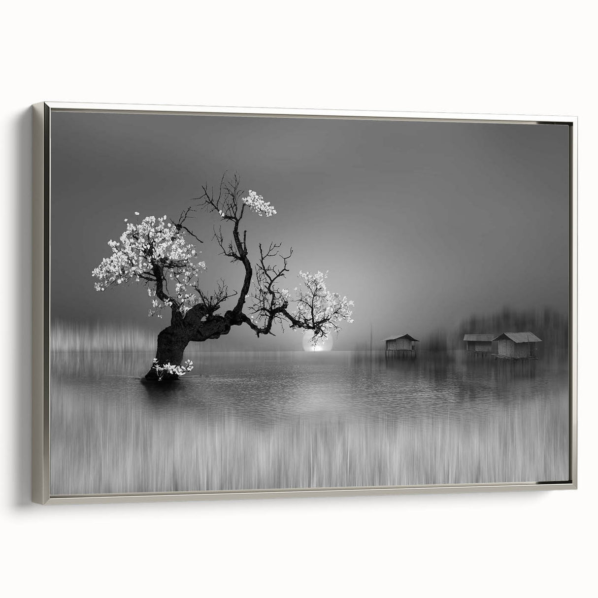 Framed canvas wall art showcasing a serene lake landscape in soft blues and greens, accented with a silver frame, ideal for home décor. Perfect for nature lovers.