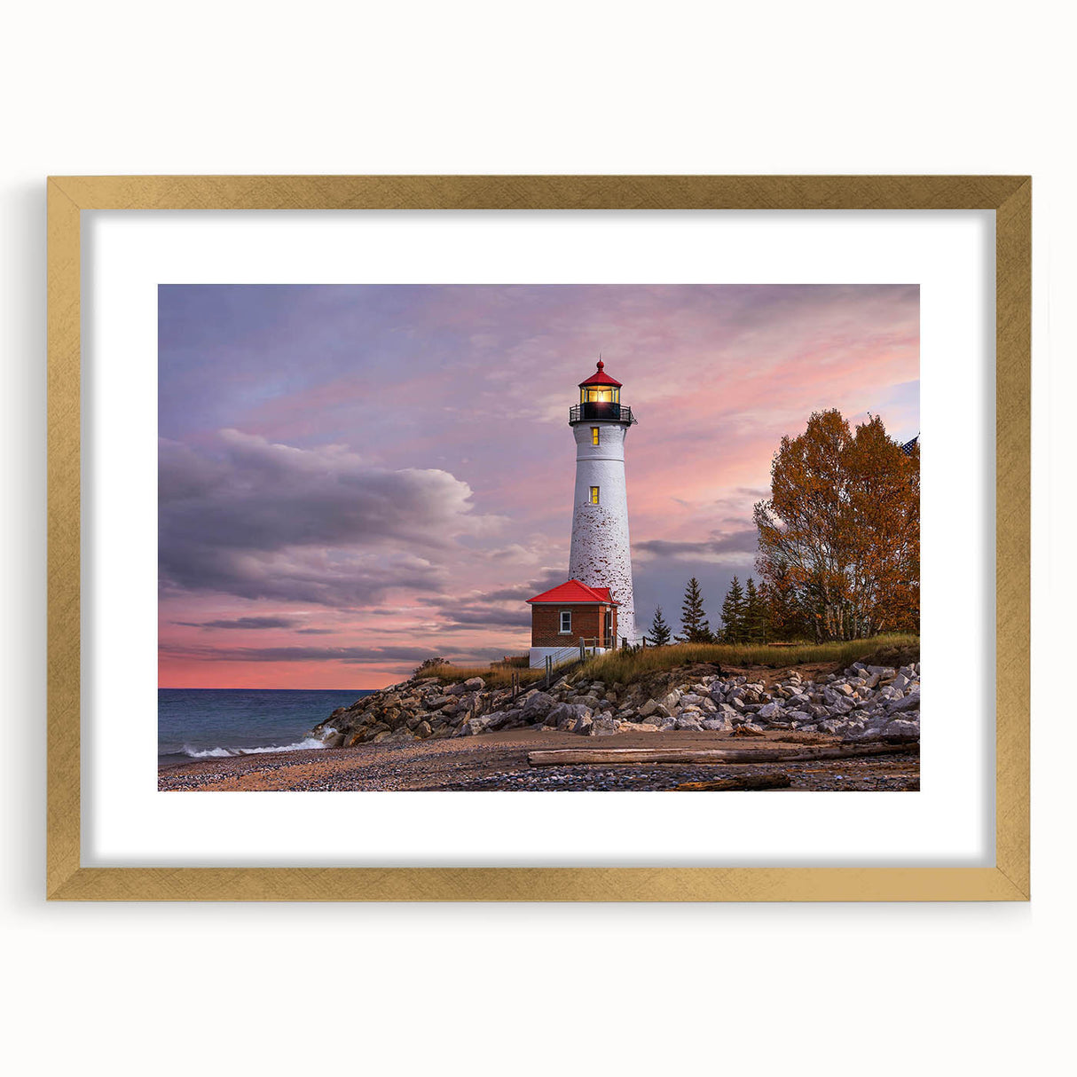 Framed wall art collection showcasing a serene lighthouse landscape design, featuring a gold mat and elegant frame, perfect for coastal home decor.