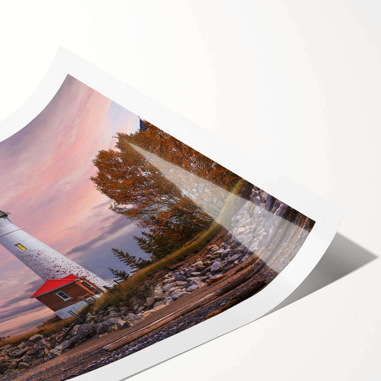 Vibrant rolled print of a lighthouse landscape design featuring a serene seascape, perfect for coastal-themed home decor, showcasing blues and whites.