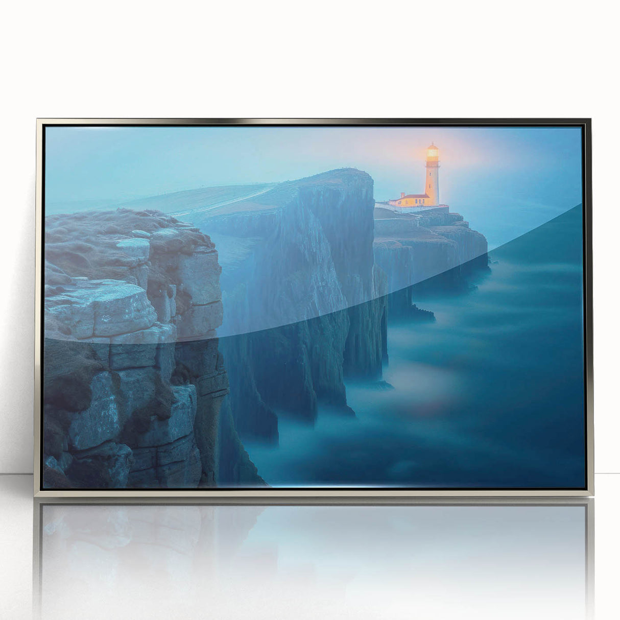 Framed acrylic wall art featuring a serene coastal lighthouse design, highlighted with silver accents, ideal for enhancing living spaces and evoking tranquility.