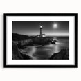 Framed wall art featuring a serene lighthouse landscape design with matting, showcasing a black frame, perfect for coastal-themed decor in living spaces.