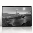 Framed acrylic wall art featuring a serene lighthouse design, showcased in a sleek black frame, perfect for enhancing coastal-themed interiors.