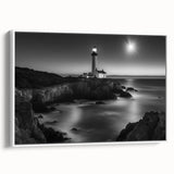 Framed canvas wall art showcasing a serene lighthouse design against a vibrant sunset, featuring a white frame and side view for a modern aesthetic. Perfect for coastal decor enthusiasts.