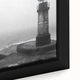 Framed canvas artwork showcasing a serene lighthouse scene with vibrant colors, ideal for coastal decor, highlighting intricate details and textures. Perfect for enhancing home or office spaces with a nautical theme.