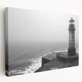 Stretched canvas wall art showcasing a serene coastal landscape with a lighthouse, featuring vibrant colors and intricate details, perfect for home decor.