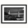 Framed wall art collection featuring a serene lighthouse landscape design with a black frame and mat, ideal for coastal-themed home decor.