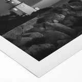 Vibrant rolled canvas wall art featuring a picturesque lighthouse surrounded by dramatic coastal scenery, perfect for enhancing home decor with a nautical theme.