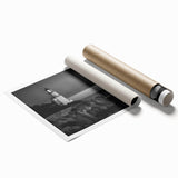 Rolled print of a coastal landscape featuring a vibrant lighthouse against a sunset sky, ideal for home decor, showcasing rich colors and serene ambiance.