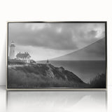 Framed wall art showcasing a serene lighthouse landscape design with silver accents, perfect for enhancing coastal-themed interiors and adding a touch of tranquility.