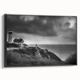 Framed canvas wall art featuring a picturesque lighthouse design, set against a vibrant landscape with rich blue skies and green fields, ideal for coastal decor.