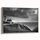 Framed canvas wall art featuring a serene coastal landscape with a lighthouse, set against a vibrant blue sky and crashing waves, ideal for nautical-themed decor.