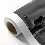 Rolled canvas art depicting a serene lighthouse landscape with vibrant colors, ideal for coastal-themed decor, elegantly packaged for safe delivery.