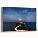 Framed canvas wall art featuring a serene lighthouse landscape design with silver framing, perfect for enhancing coastal-themed decor in living spaces.