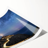 Lighthouse-themed wall art print showcasing a serene coastal landscape with vibrant blues and greens, ideal for beach house decor, rolled for easy framing.