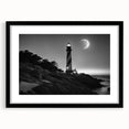 Framed wall art showcasing a serene lighthouse landscape, featuring a black frame and mat, perfect for coastal-themed decor. Ideal for home or office styling.