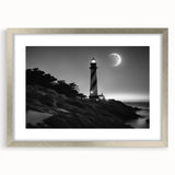 Framed silver wall art featuring a scenic lighthouse landscape design, complete with a white mat, perfect for coastal-themed home decor. Ideal for adding elegance to any living space.