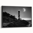 Framed canvas wall art depicting a serene lighthouse landscape with a vibrant sunset, featuring a black frame that enhances the coastal aesthetic. Ideal for home decor.