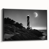 Framed canvas wall art depicting a serene lighthouse landscape with a vibrant sunset, featuring a black frame that enhances the coastal aesthetic. Ideal for home decor.