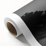 Lighthouse wall art on rolled canvas, showcasing vibrant coastal scenery with a bright blue sky and lush greenery, perfect for nautical-themed decor.