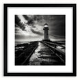 Framed wall art featuring a serene lighthouse landscape design with a black mat, perfect for coastal home decor, showcasing calming blues and white tones.