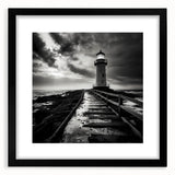 Framed wall art featuring a serene lighthouse landscape design with a black mat, perfect for coastal home decor, showcasing calming blues and white tones.