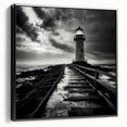Framed canvas wall art featuring a serene lighthouse design with a scenic landscape, displayed from a side view against a black background, perfect for coastal decor.