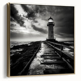 Framed canvas wall art featuring a serene lighthouse design in silver and gold tones, set against a tranquil seascape, perfect for enhancing coastal decor.