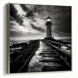 Framed canvas wall art featuring a serene lighthouse design against a tranquil seascape, accented with a silver frame, ideal for coastal-themed decor.