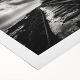 Rolled canvas wall art featuring a serene lighthouse design set against a vibrant sunset, showcasing rich colors and intricate details, ideal for coastal-themed decor.