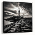 Framed canvas wall art showcasing a scenic lighthouse design with a black frame, ideal for coastal-themed decor. The artwork captures vibrant colors and intricate details, enhancing any living space with its nautical charm.