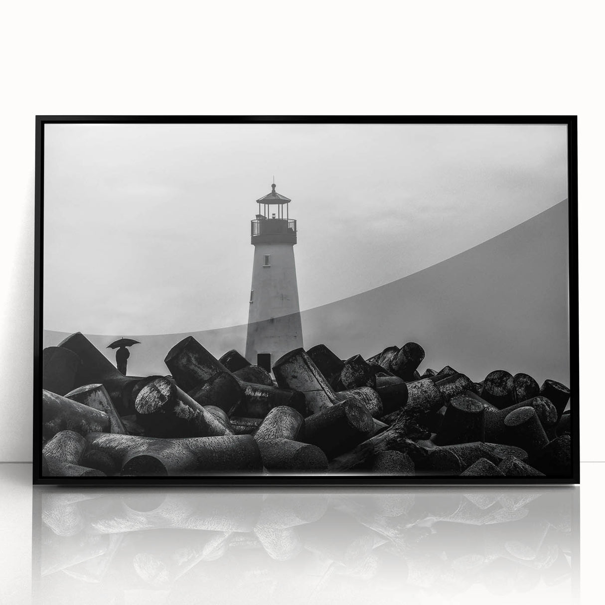 Framed wall art featuring a coastal lighthouse design, showcasing vibrant colors and intricate details in a black frame, perfect for home decor enthusiasts.