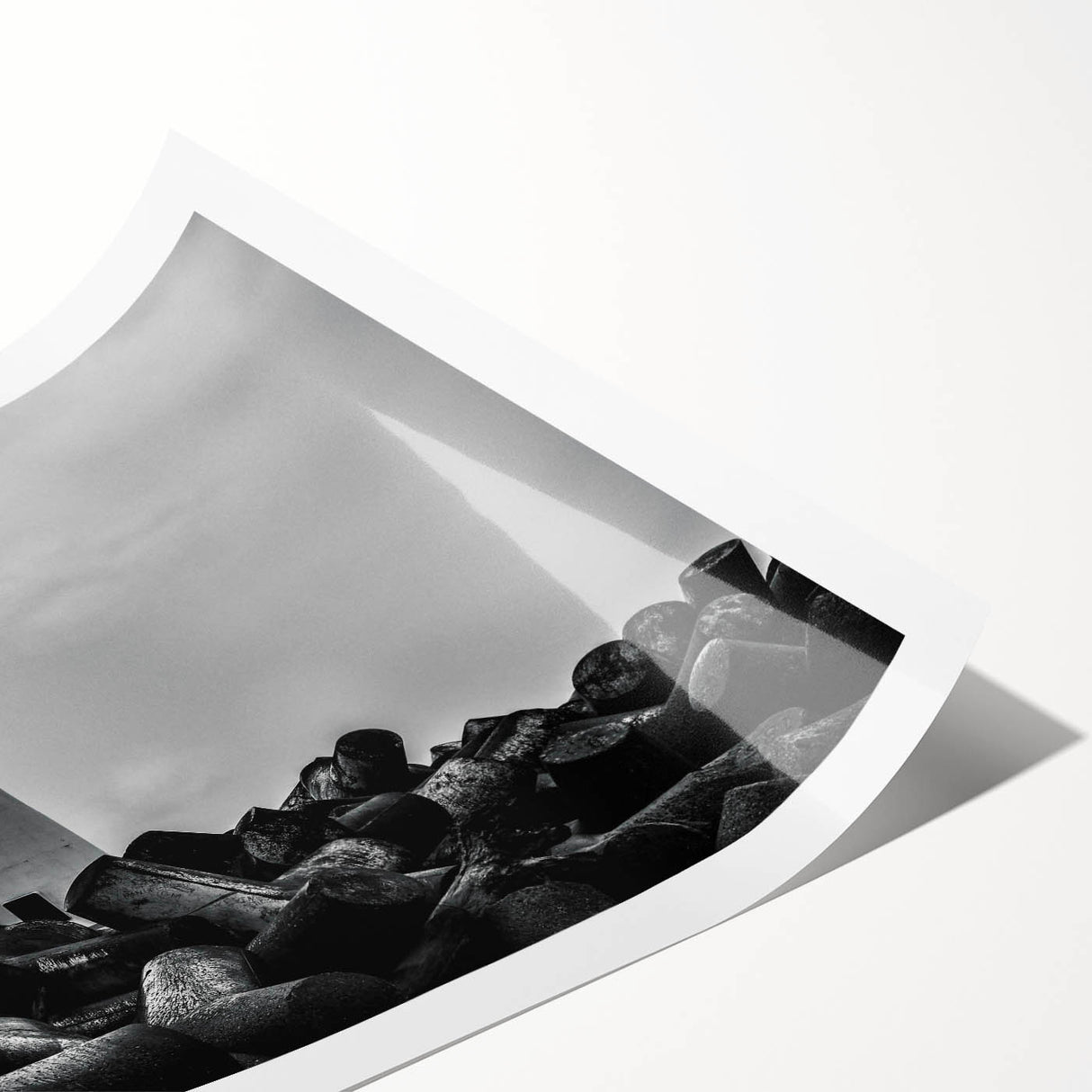 Rolled print showcasing a serene lighthouse landscape with vibrant colors and intricate details, perfect for coastal-themed decor or art collection.