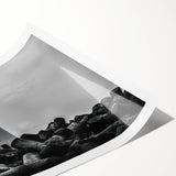 Rolled print showcasing a serene lighthouse landscape with vibrant colors and intricate details, perfect for coastal-themed decor or art collection.
