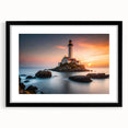 Black-framed wall art featuring a serene lighthouse landscape design, showcasing vibrant colors and intricate details, perfect for coastal-themed decor.