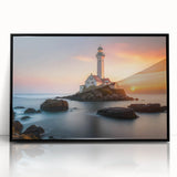 Framed acrylic wall art featuring a serene landscape with a lighthouse, showcasing vibrant colors against a black frame, ideal for coastal-themed decor.