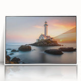 Framed acrylic wall art showcasing a picturesque lighthouse design, set against a serene landscape with vibrant colors, perfect for coastal decor enthusiasts.