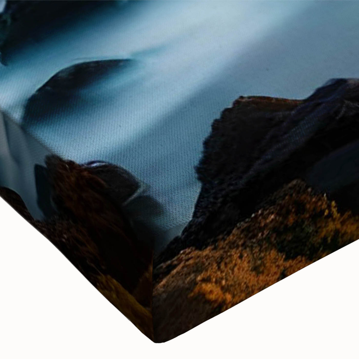 Close-up of a stretched canvas wall art collection featuring a serene lighthouse design amidst a vibrant coastal landscape, perfect for home decor enthusiasts seeking nautical-themed artwork.
